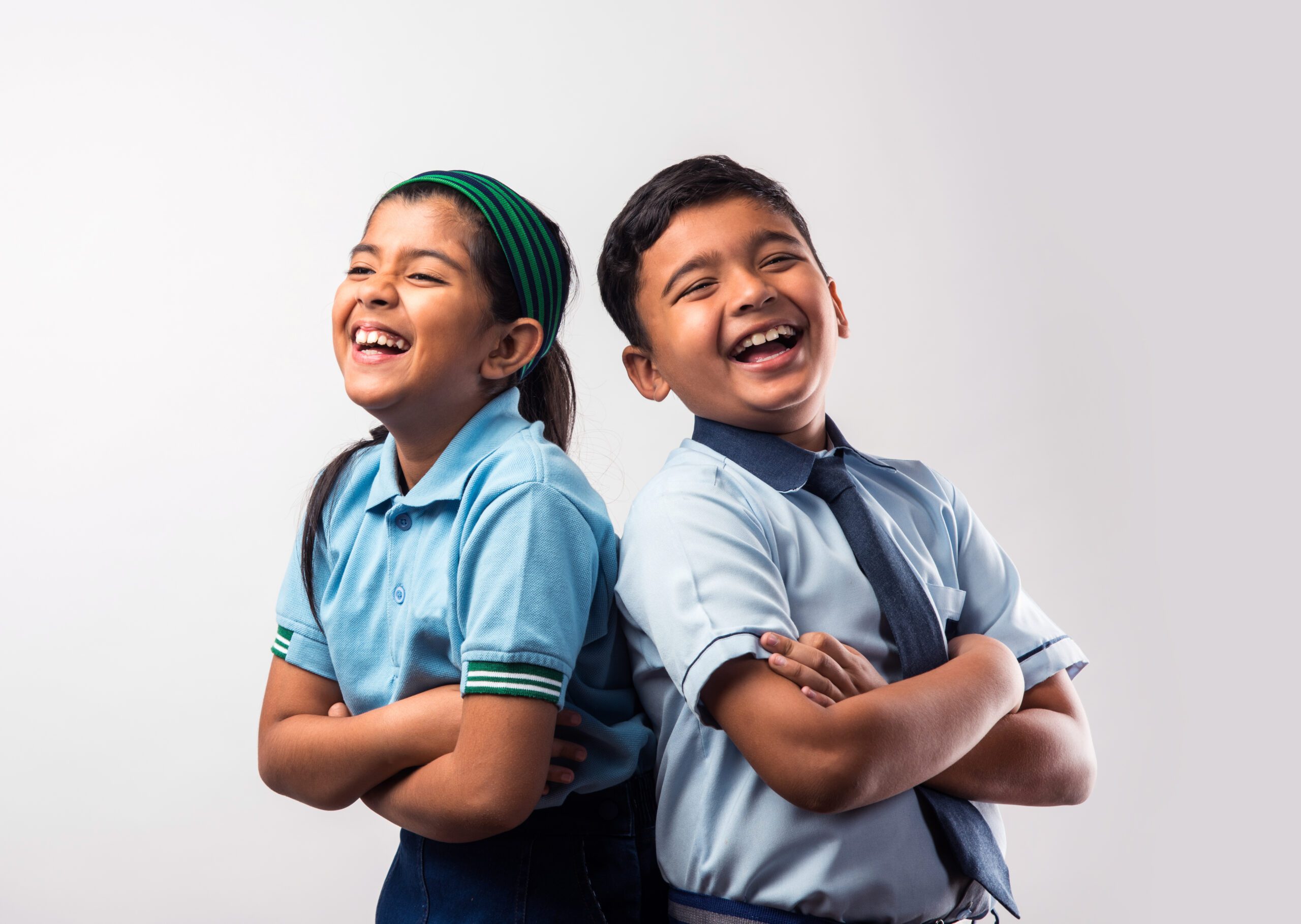 Group of cheerful students wearing the smart, formal school uniforms provided by Pathanjali Knitwear, symbolizing unity and discipline in educational settings.